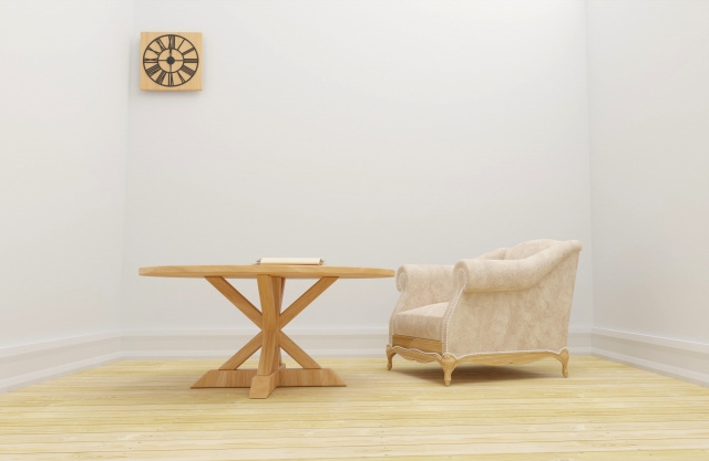 椅子とテーブルと時計だけのシンプルな部屋